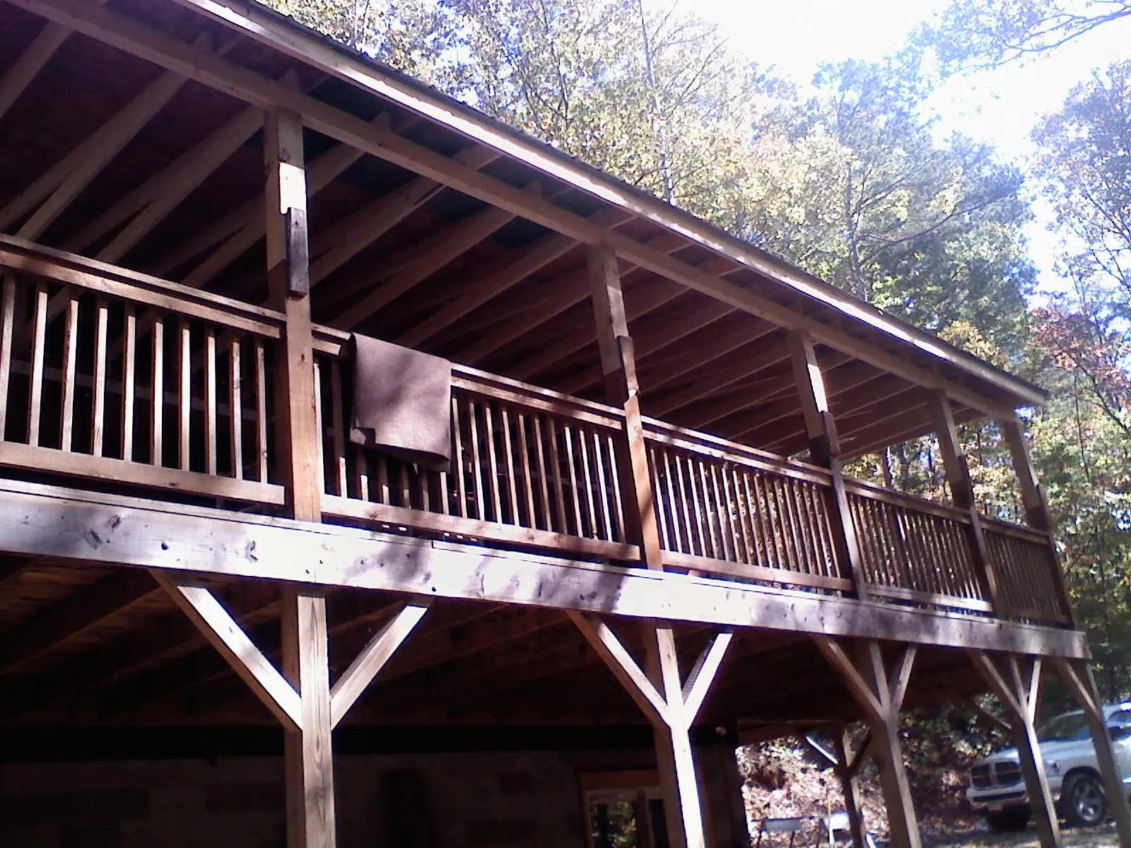 Timber framing under a new elevated porch and deck — Roof Leak Repair in Piney Point by Roofing Brothers